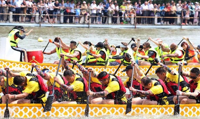 People take part in dragon boat races across China