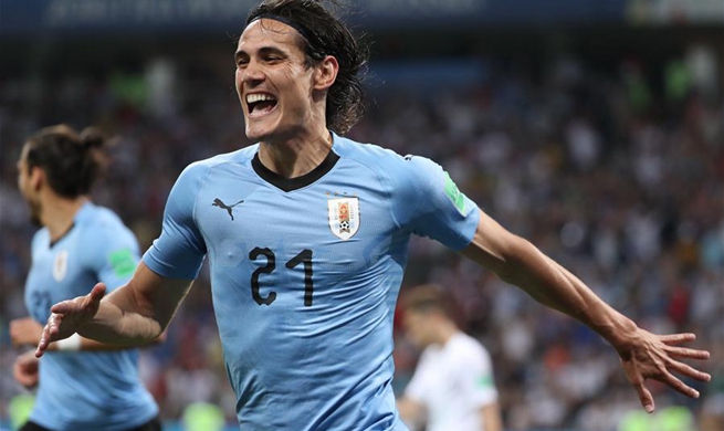 Cavani scores twice to send Uruguay to the last eight