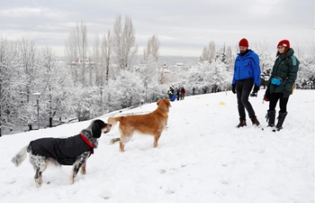 People play on snow in Ankara, Turkey